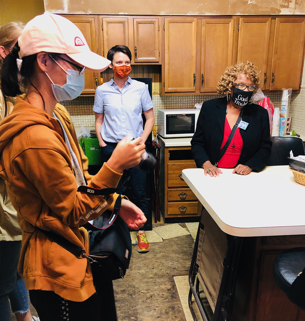 YifeiYang, Aislinn Pentecost-Farren, and Janice Sykes-Ross at the kitchen of 4951 Walnut Street. Photo by Pamela W. Hawkes.