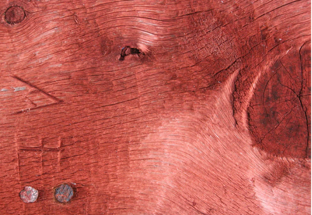 Wood staining from red ochre and cod liver oil paint.