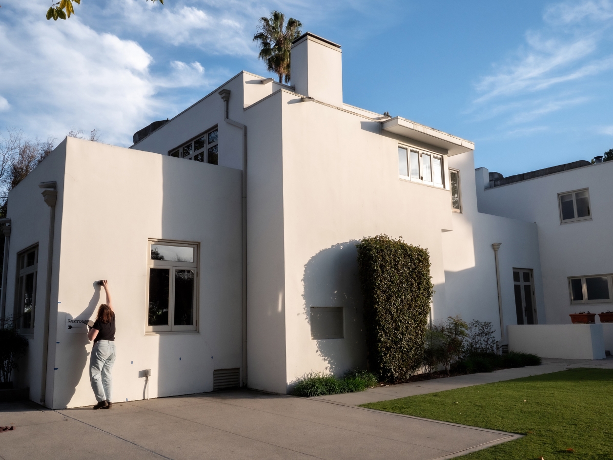Kate using ground-penetrating radar (GPR) to scan the “Gill System” wall assembly at the Clarke house in Santa Fe Springs, California.